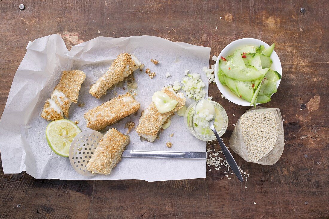 Sesame fish fingers with wasabi mayo and cucumber salad