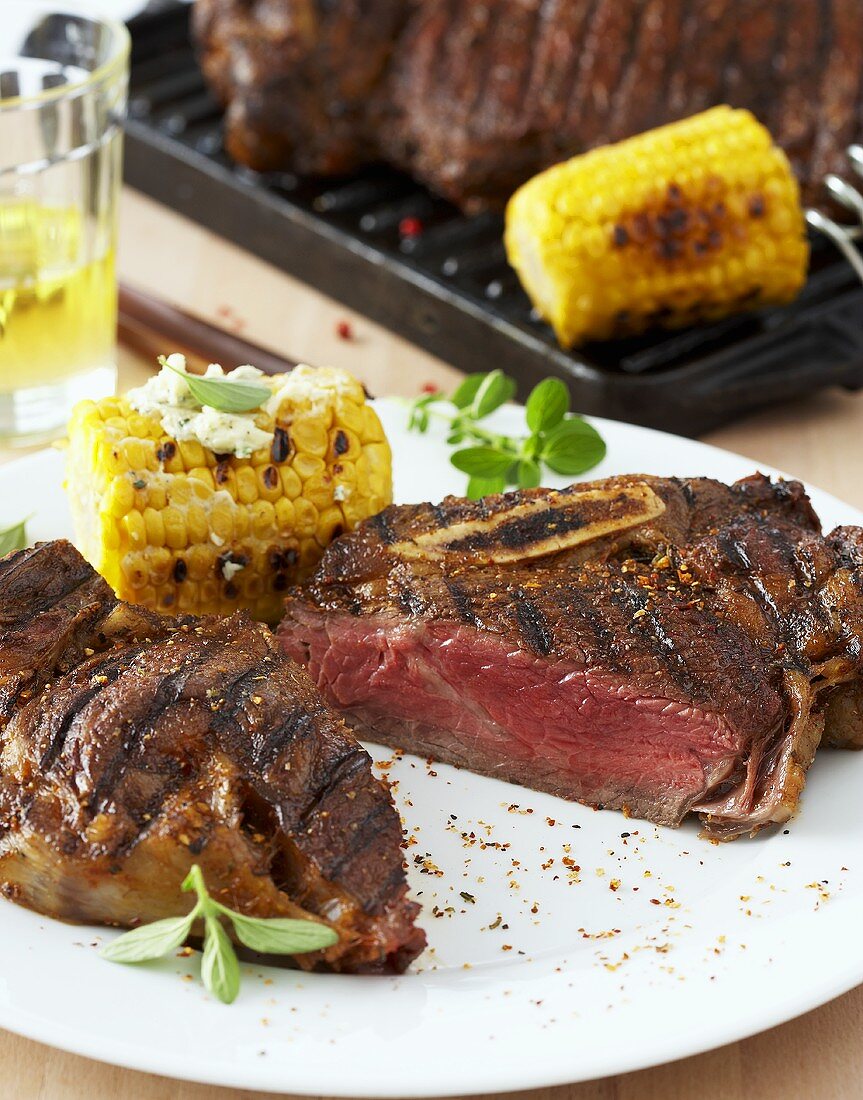 Grilled Porterhouse steak with grilled corn on the cob