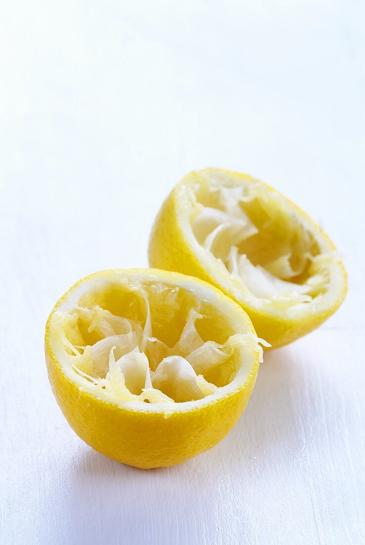 Two squeezed lemon halves