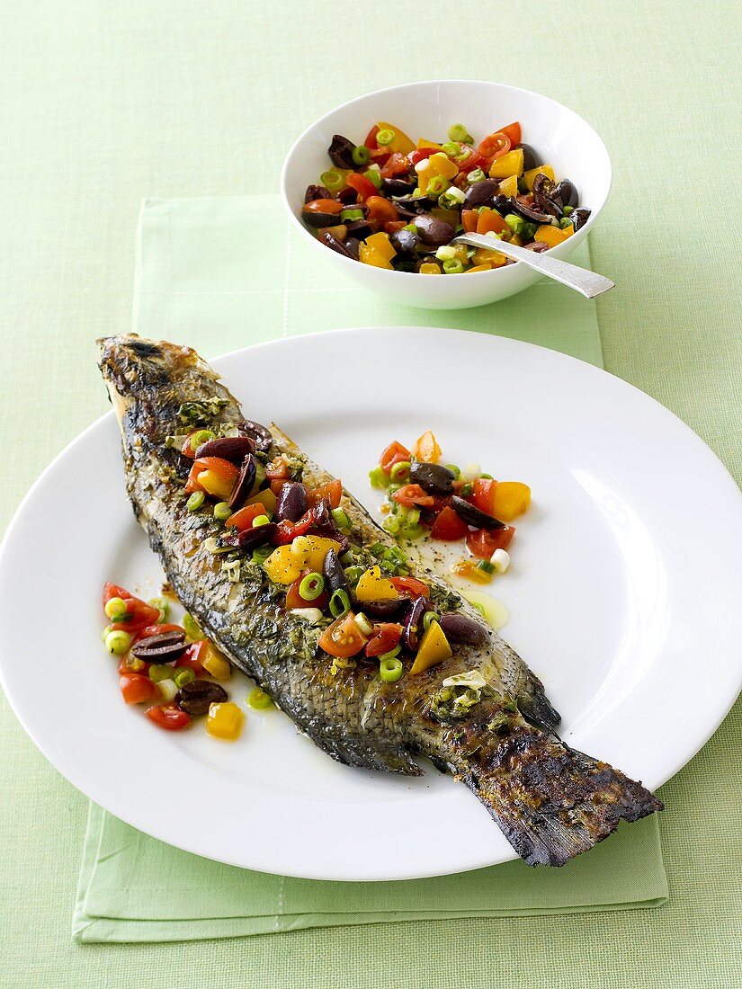 Fried fish with tomato and olive salsa