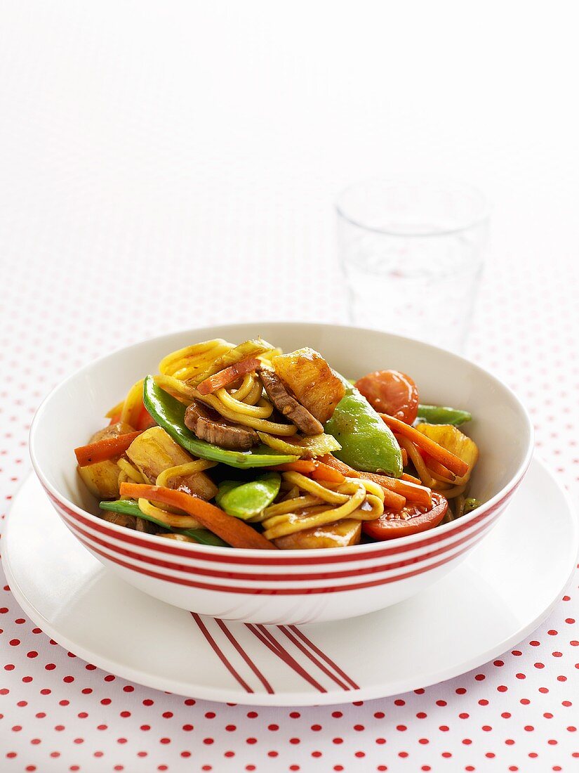 Sweet and sour pork with vegetables and noodles