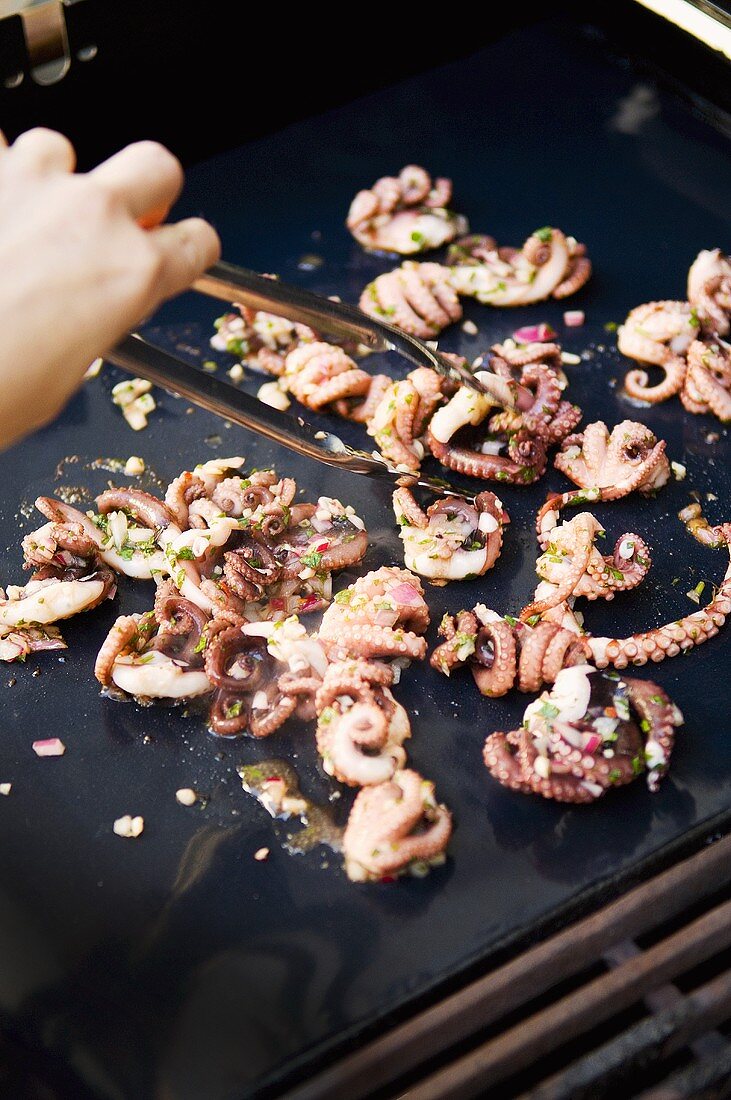 Frying marinated octopus