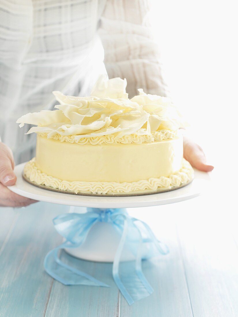 White chocolate cake for special occasion on cake stand