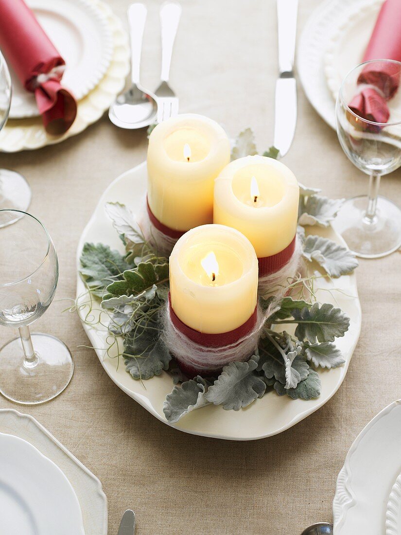 Christmas table decoration with three candles