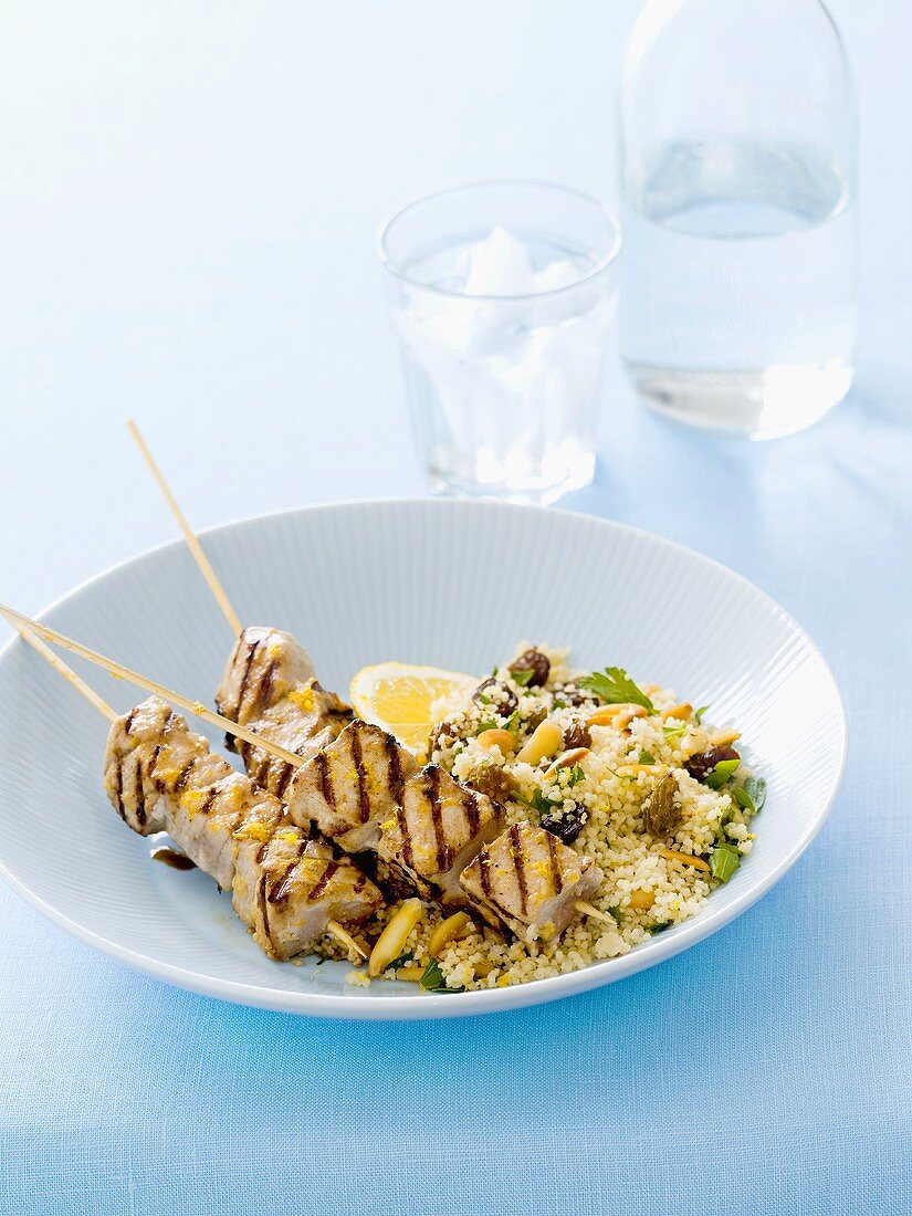 Grilled fish kebabs with orange and ginger, couscous