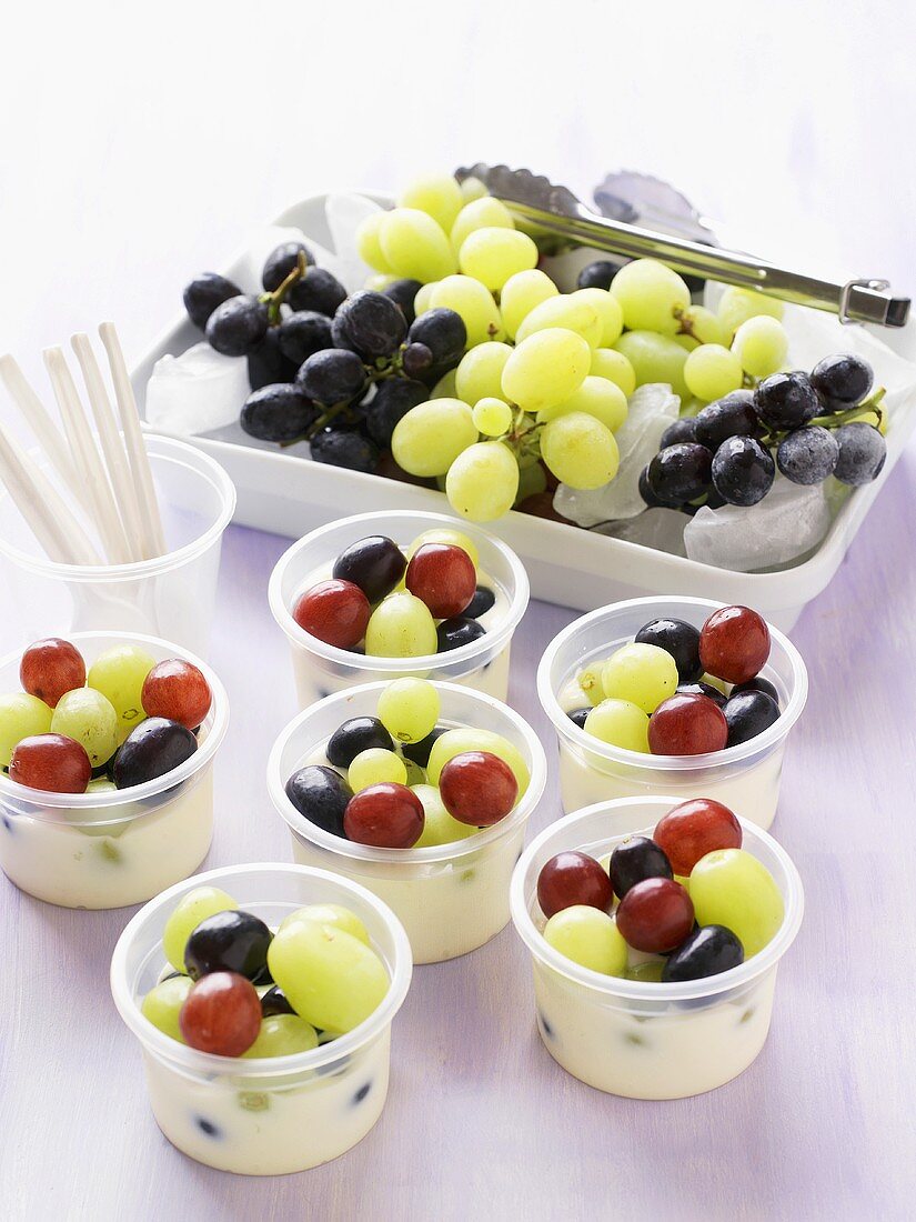 Grape dessert in plastic tubs