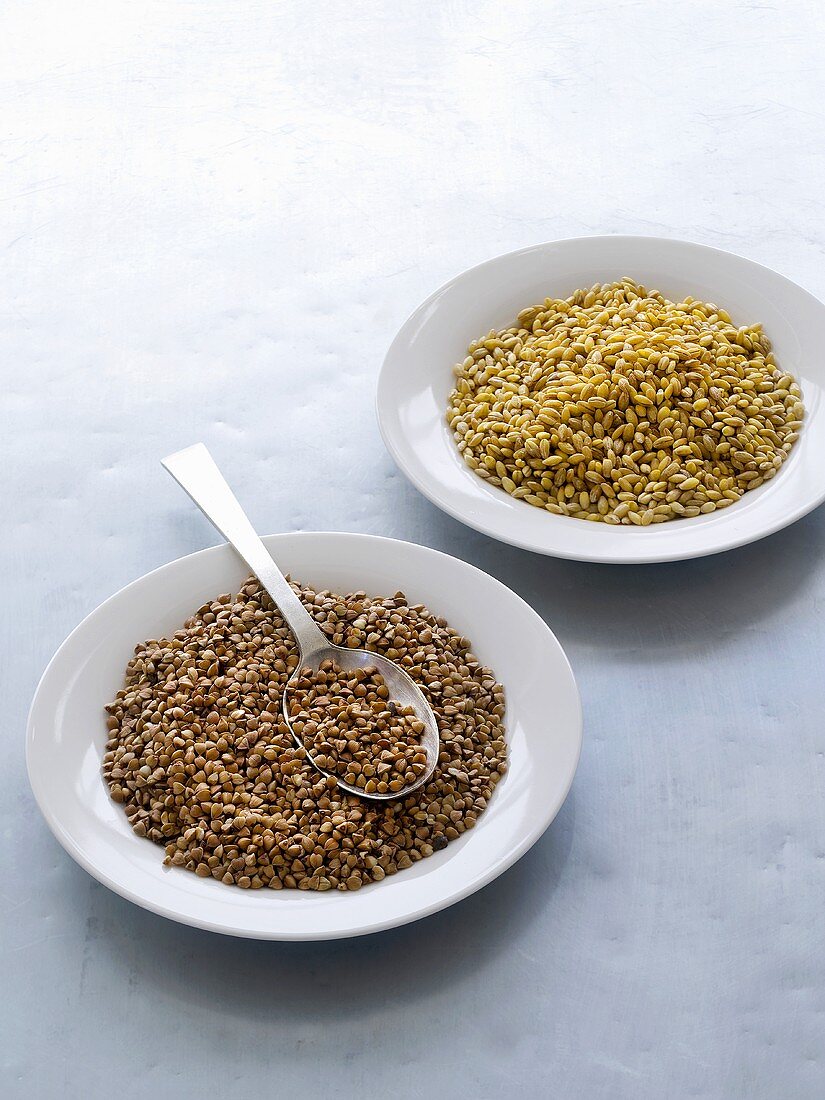 Buckwheat and barley on two plates