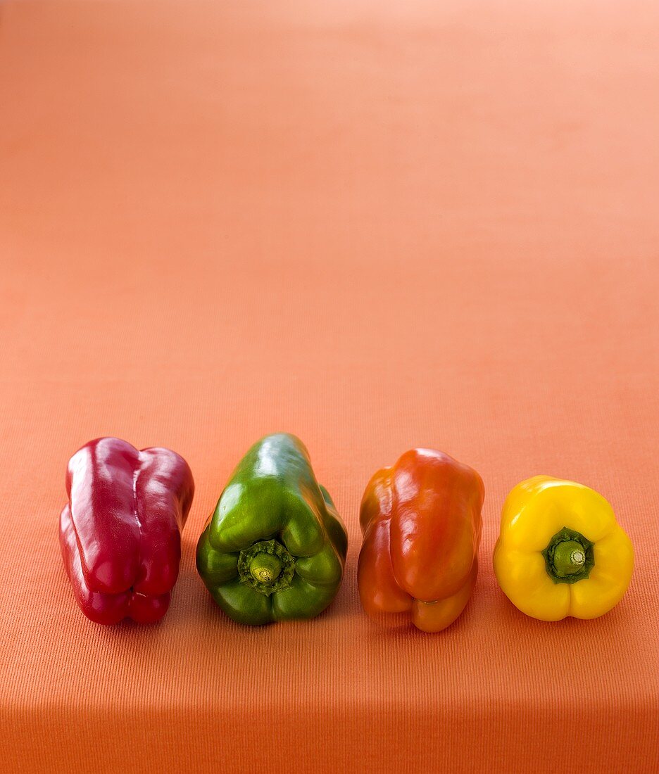 Four peppers (red, green, orange, yellow)