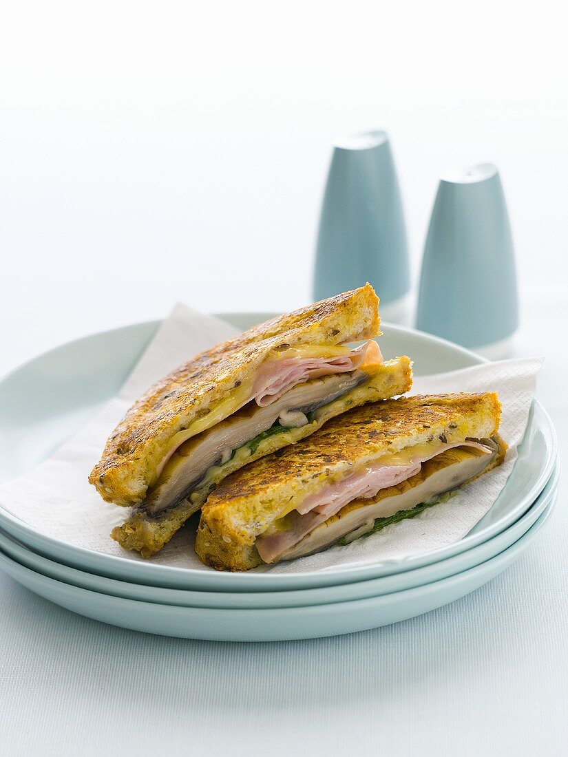 Toasted cheese, mushroom and ham sandwiches