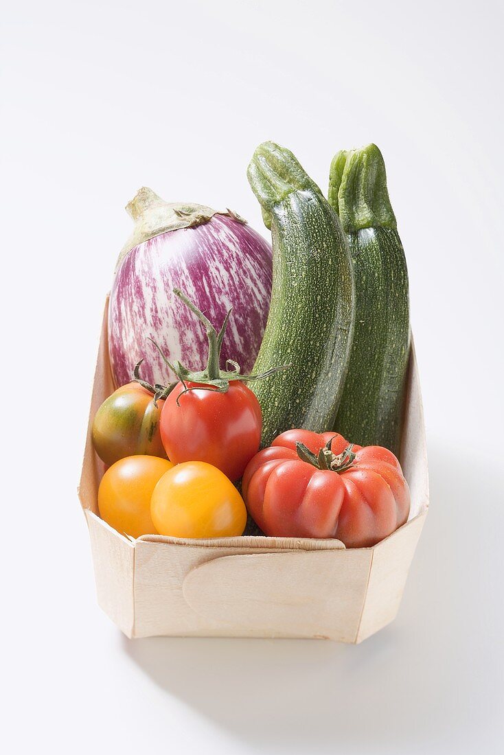 Assorted vegetables in a woodchip box