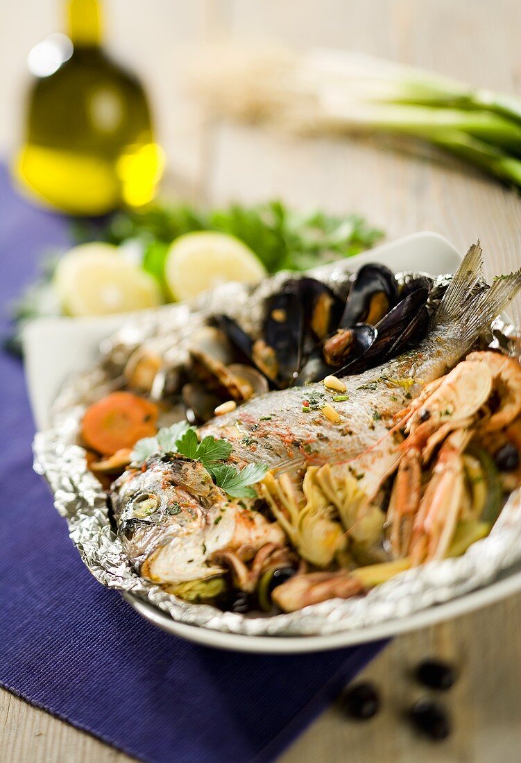 Sea bream with shellfish cooked in foil