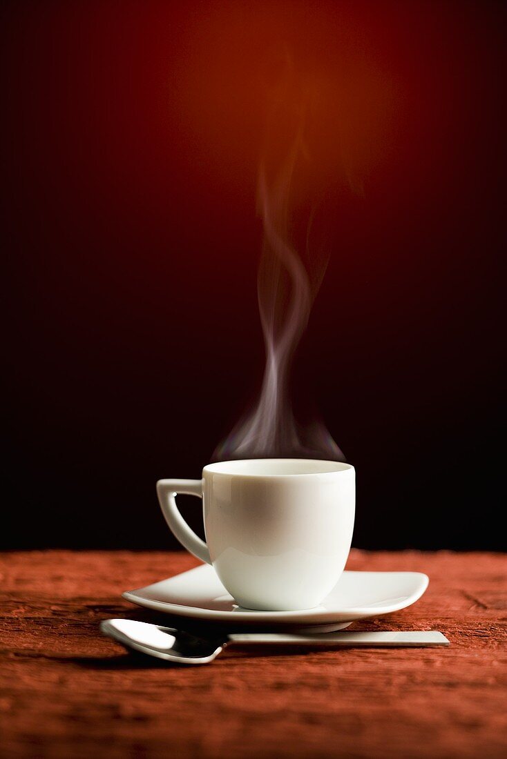 A steaming coffee cup