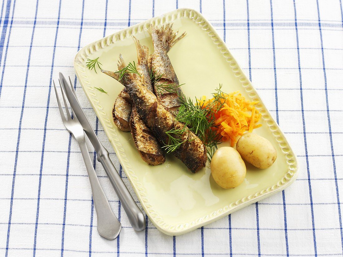 Baltic herrings with carrot salad and boiled potatoes