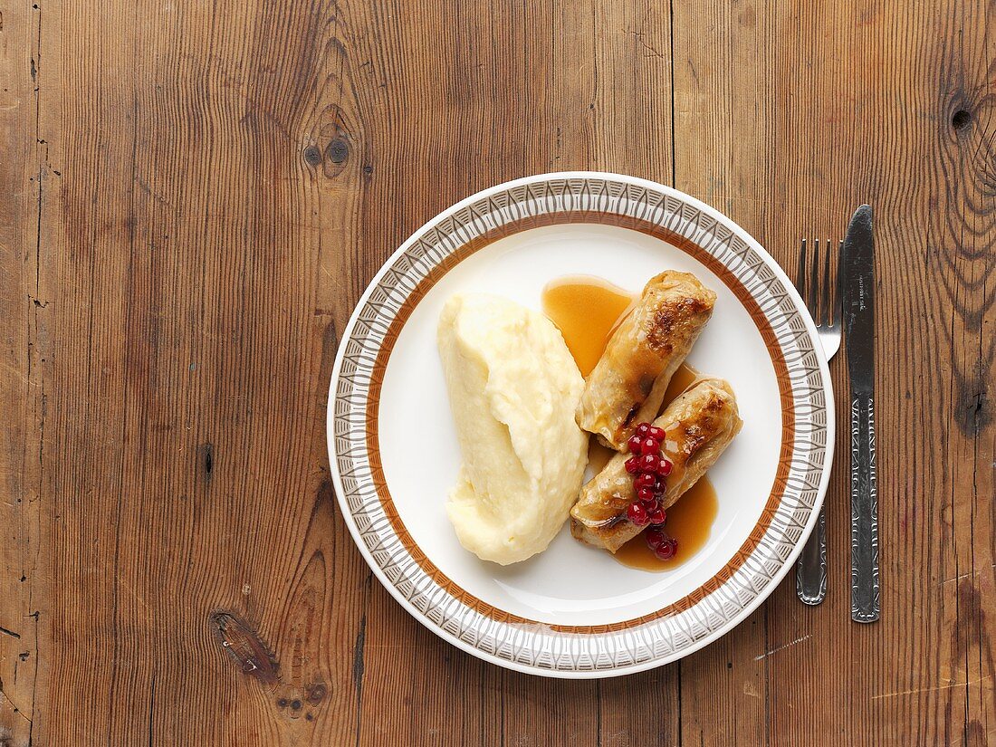 Stuffed cabbage leaves with mashed potato & cranberry compote