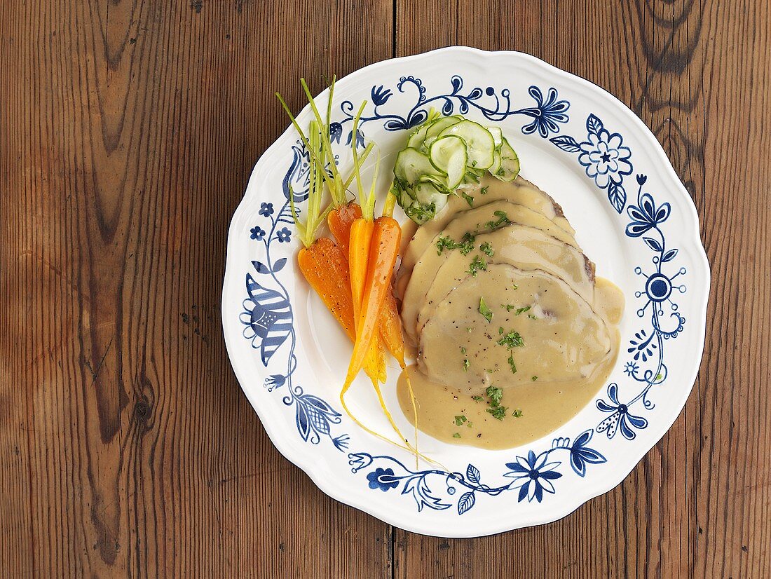 Roast beef in cream sauce with carrots