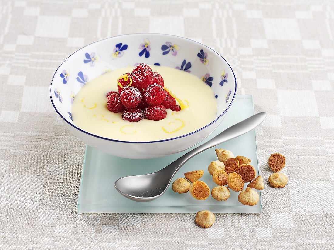 Lemon soup with raspberries and almond biscuits