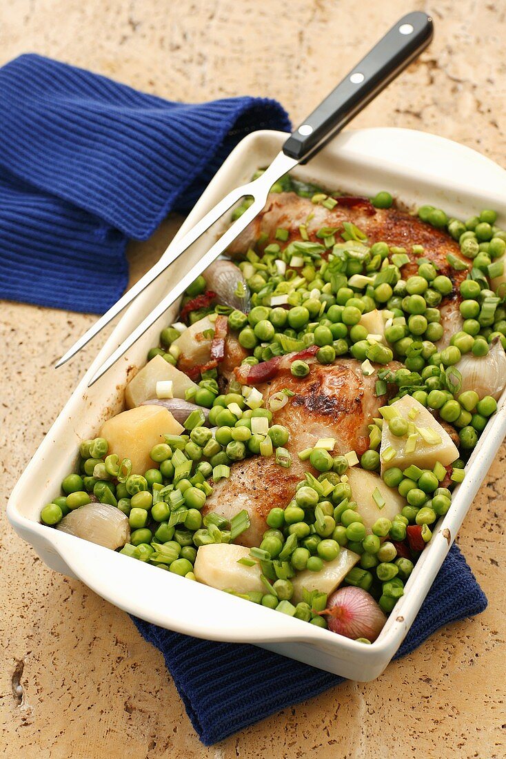 Baked chicken, potatoes, shallots and peas