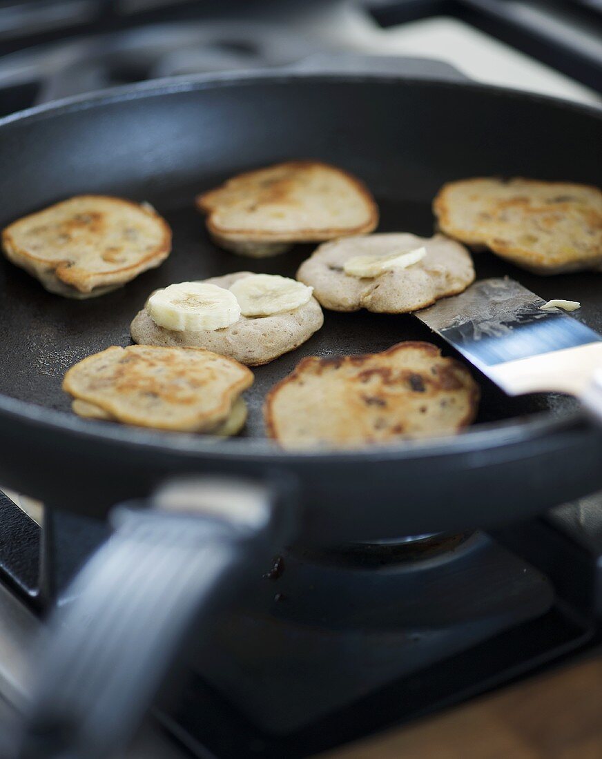 Frying banana pancakes in a frying pan