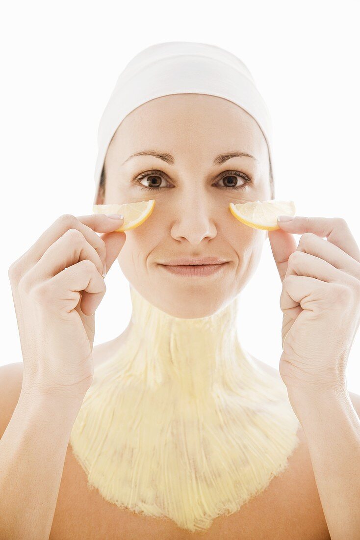 Woman with facial mask on neck and upper chest