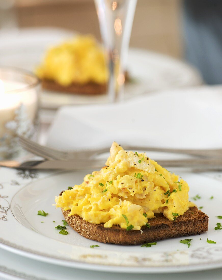 Scrambled egg with crabmeat on toast
