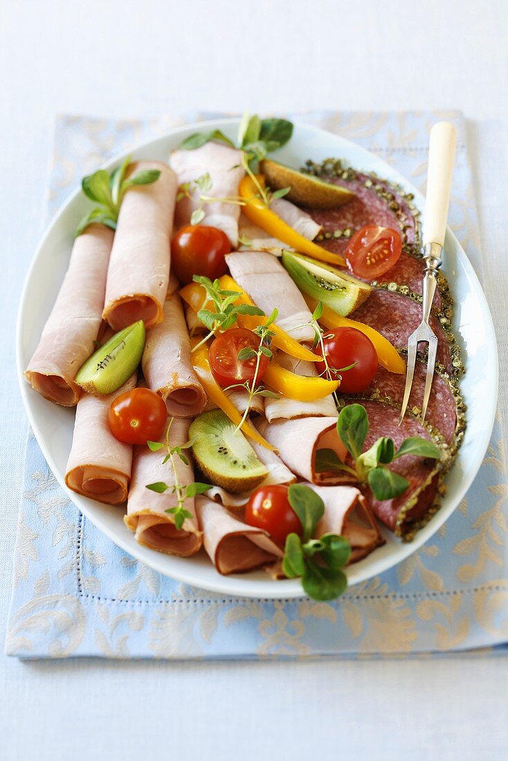 Ham and salami platter with garnish