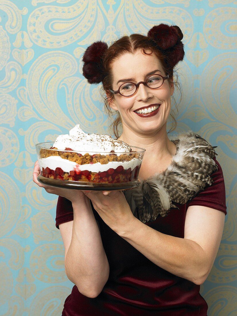 Woman serving Black Forest style trifle