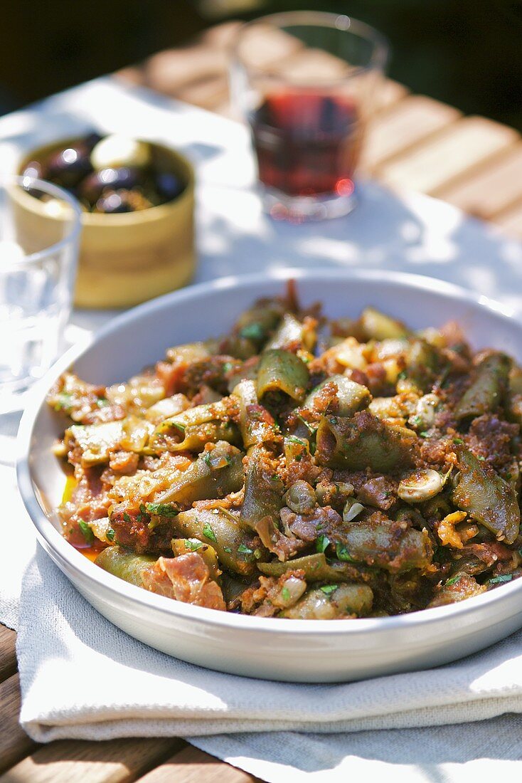 Tapas: bean stew, pickled olives (Spain)