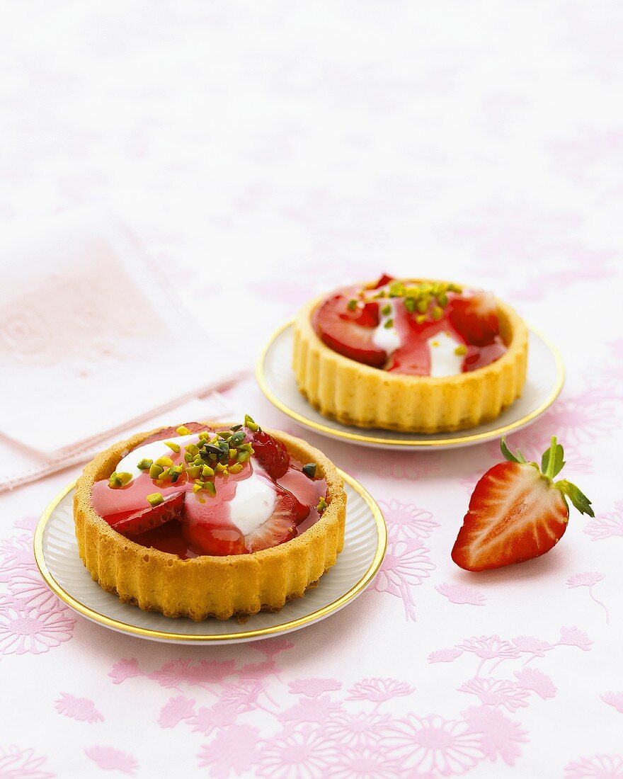 Two individual strawberry flans