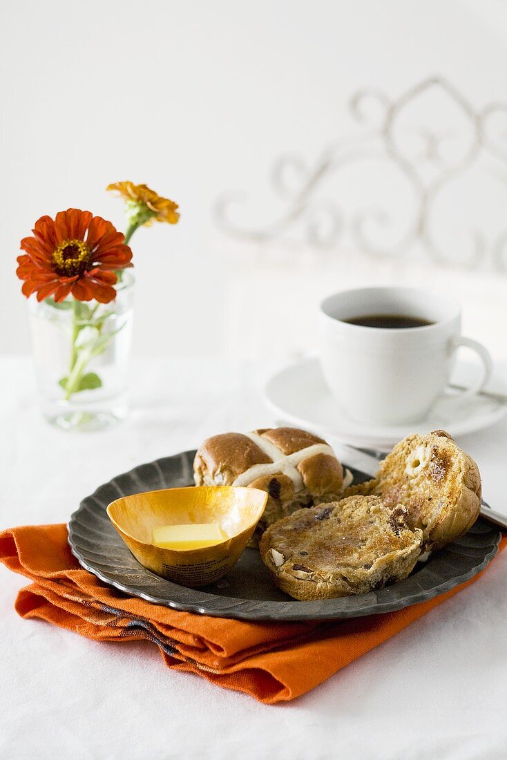 Breakfast in bed: hot cross buns, butter and coffee