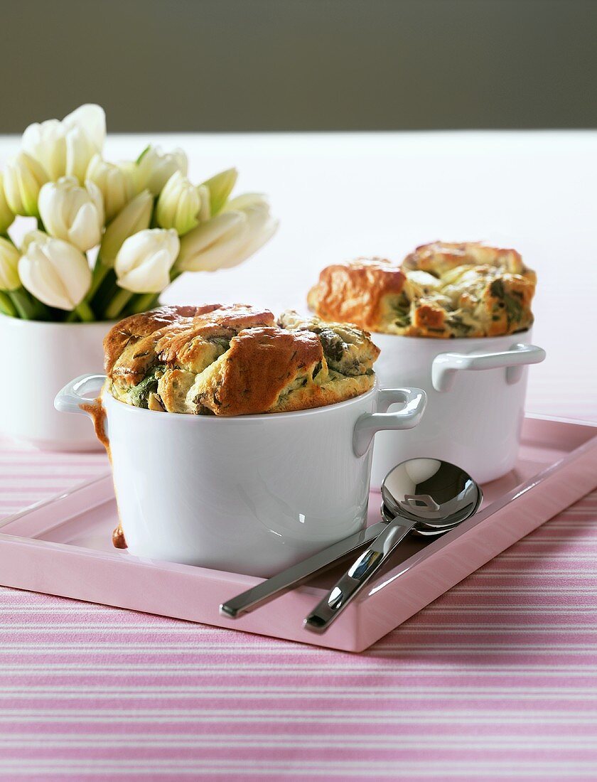 Two herb soufflés on a tray