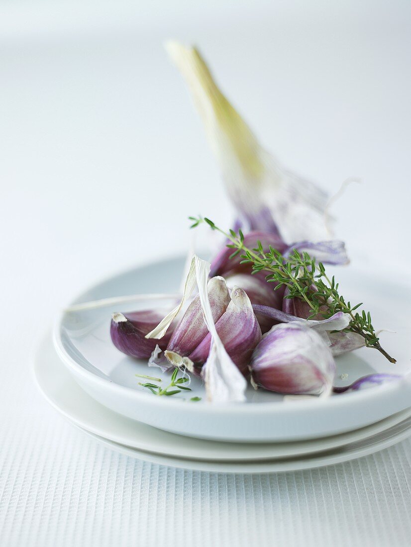 Garlic cloves and sprigs of thyme