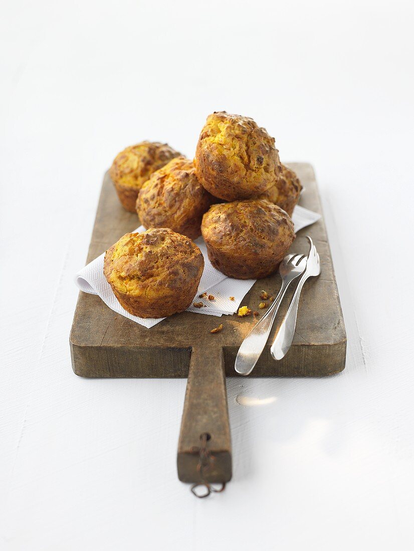 Pumpkin muffins on a wooden board