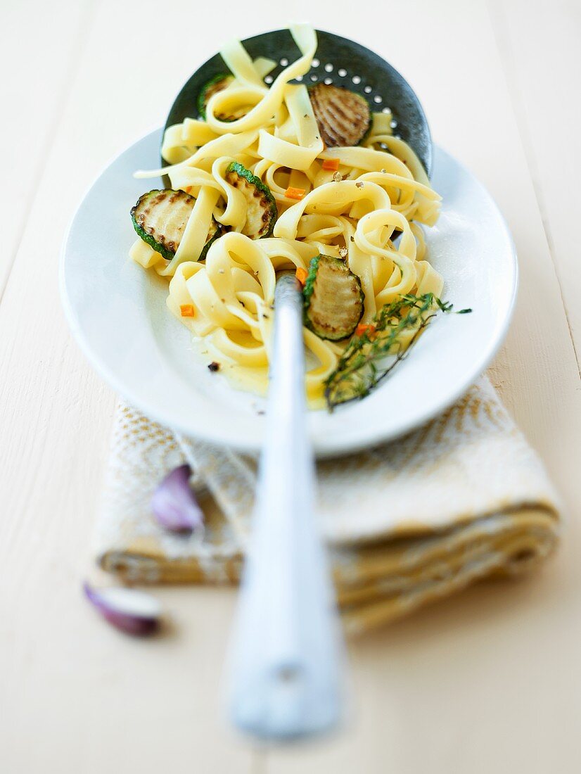 Tagliatelle with fried courgettes, carrots and thyme