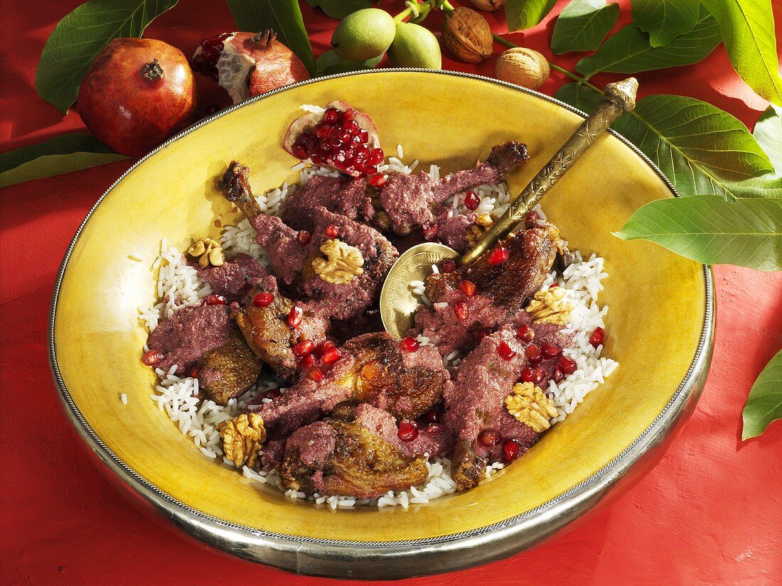 Braised duck in pomegranate and walnut sauce on rice