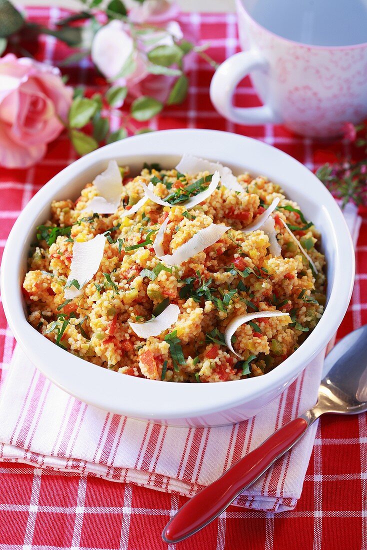 Couscous with peppers, parsley and cheese shavings