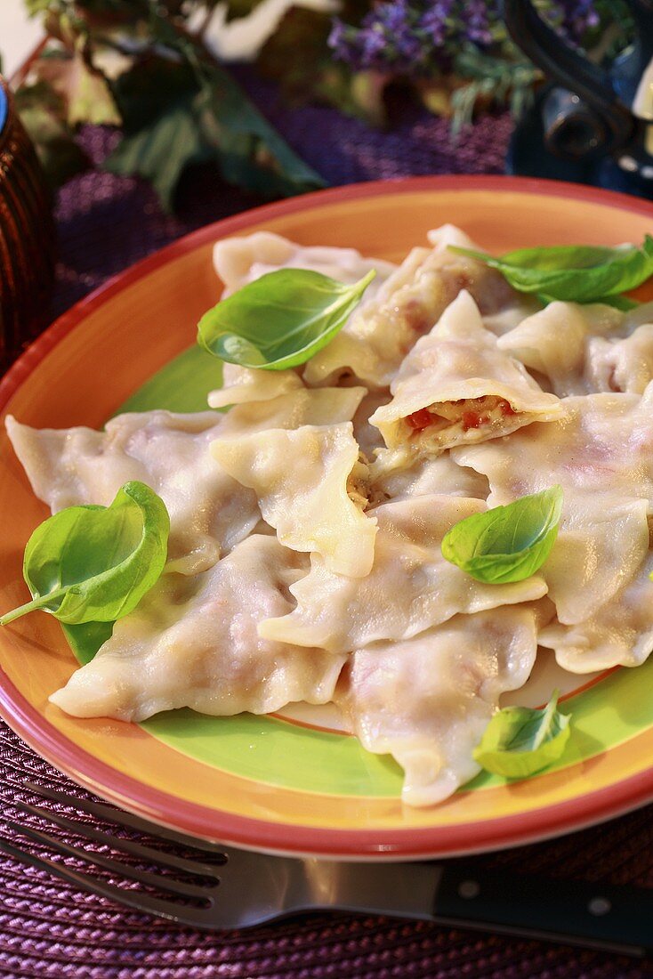 Ravioli with cheese filling and basil