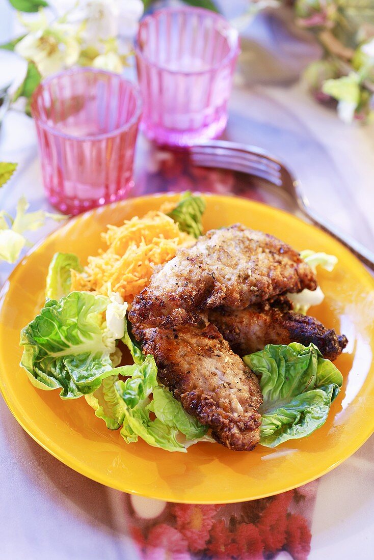 Nut-coated chicken with salad