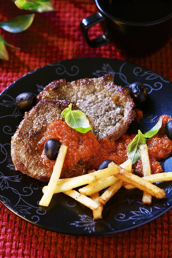 Beefsteak with red pepper sauce and chips