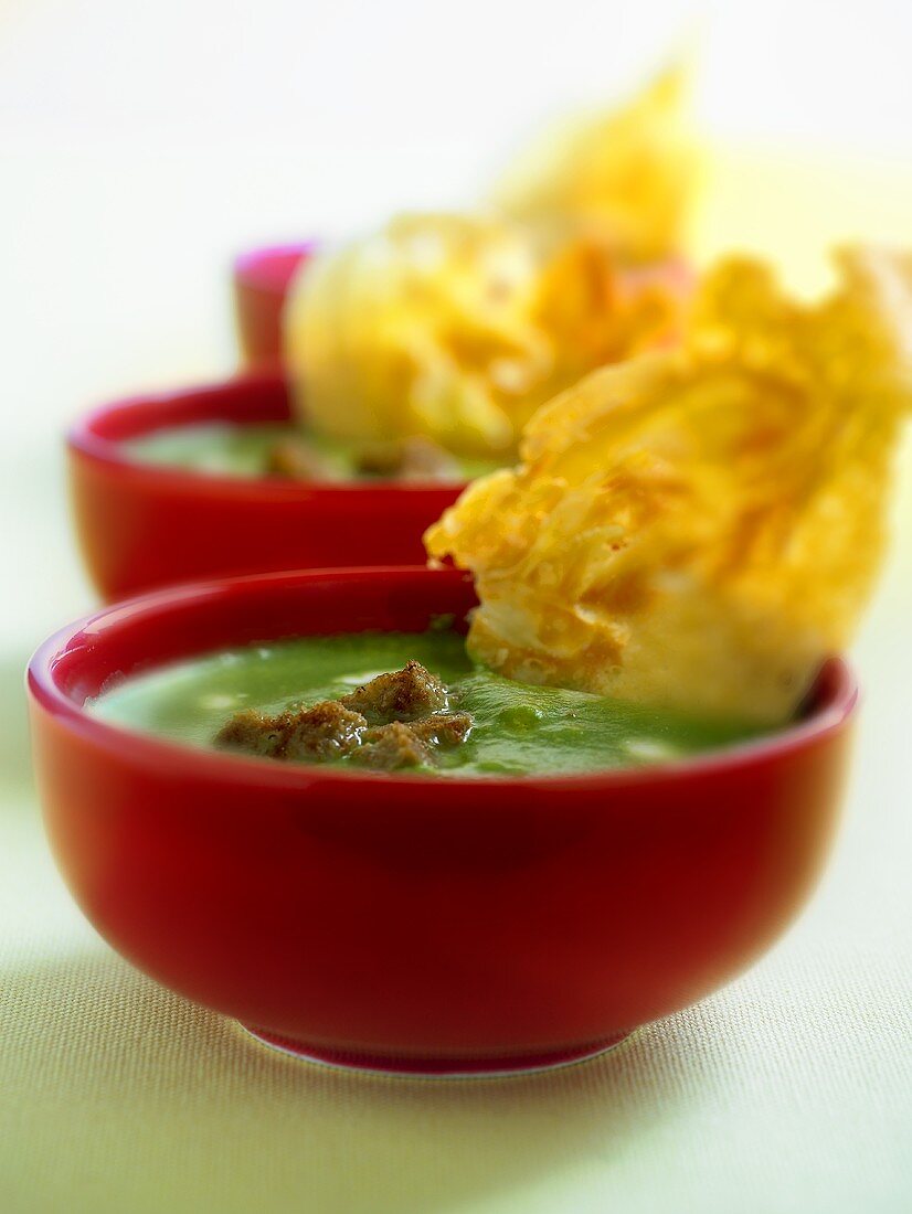 Three bowls of spinach soup
