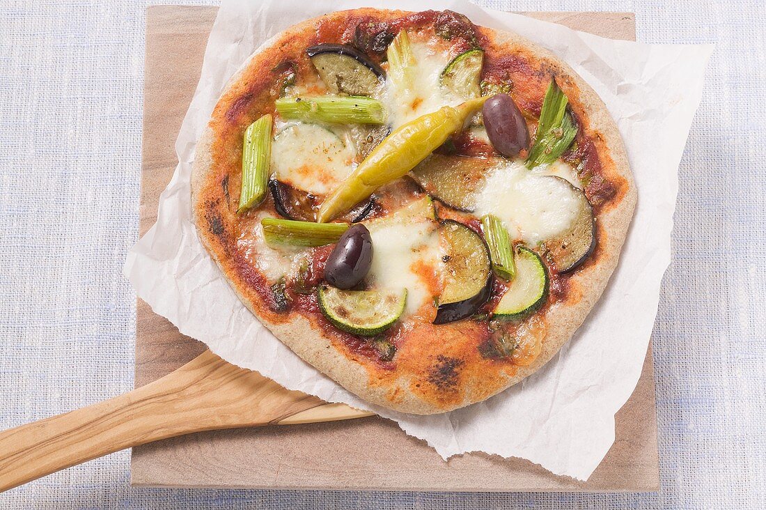 Wholemeal vegetable pizza on paper