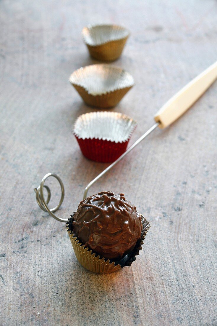 Chocolate truffle in a foil case