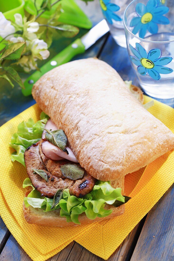 Escalope with sage and salad in ciabatta