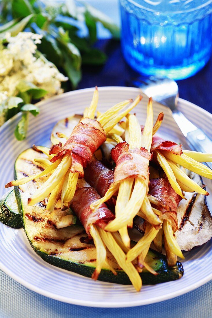 Grilled vegetables with bacon-wrapped beans