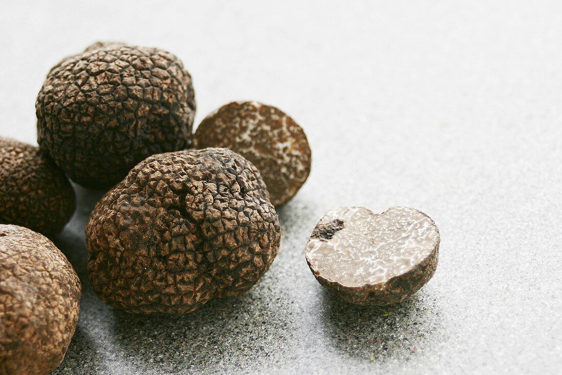 Black truffles (Chinese truffles) whole and halved
