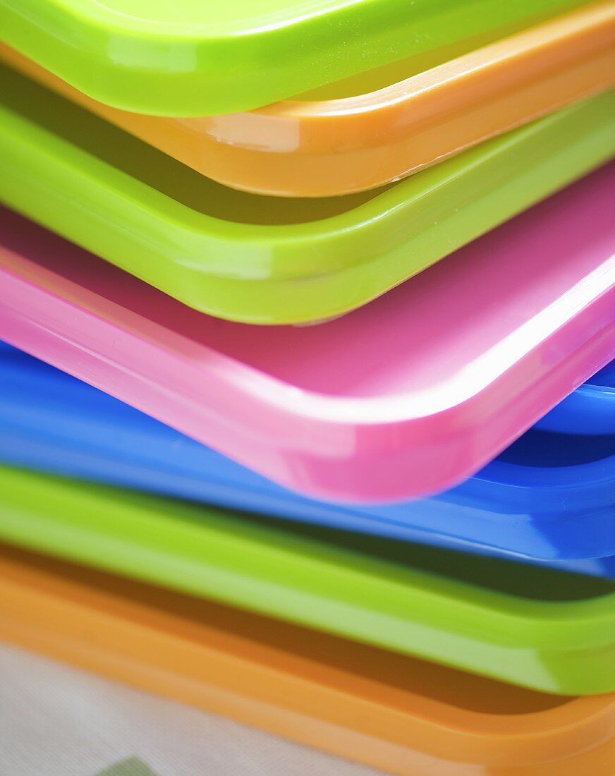 Stacked coloured plastic lids