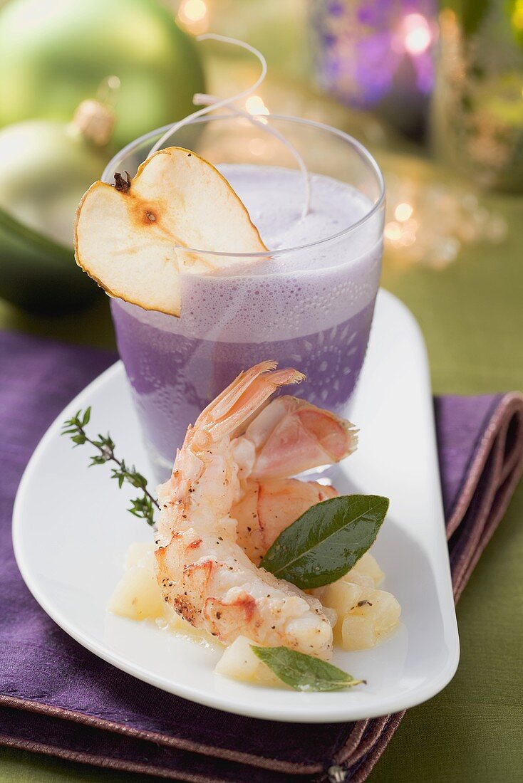 Red cabbage foam soup with pear and langoustines
