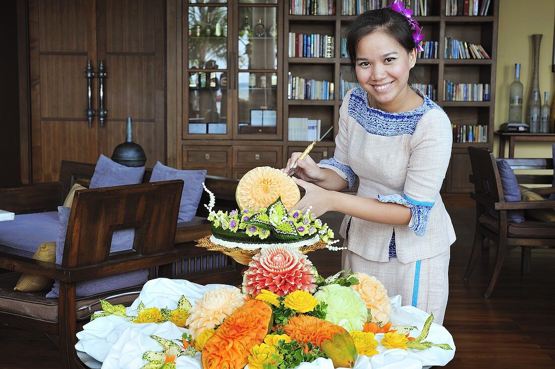 Thai woman with carved fruit