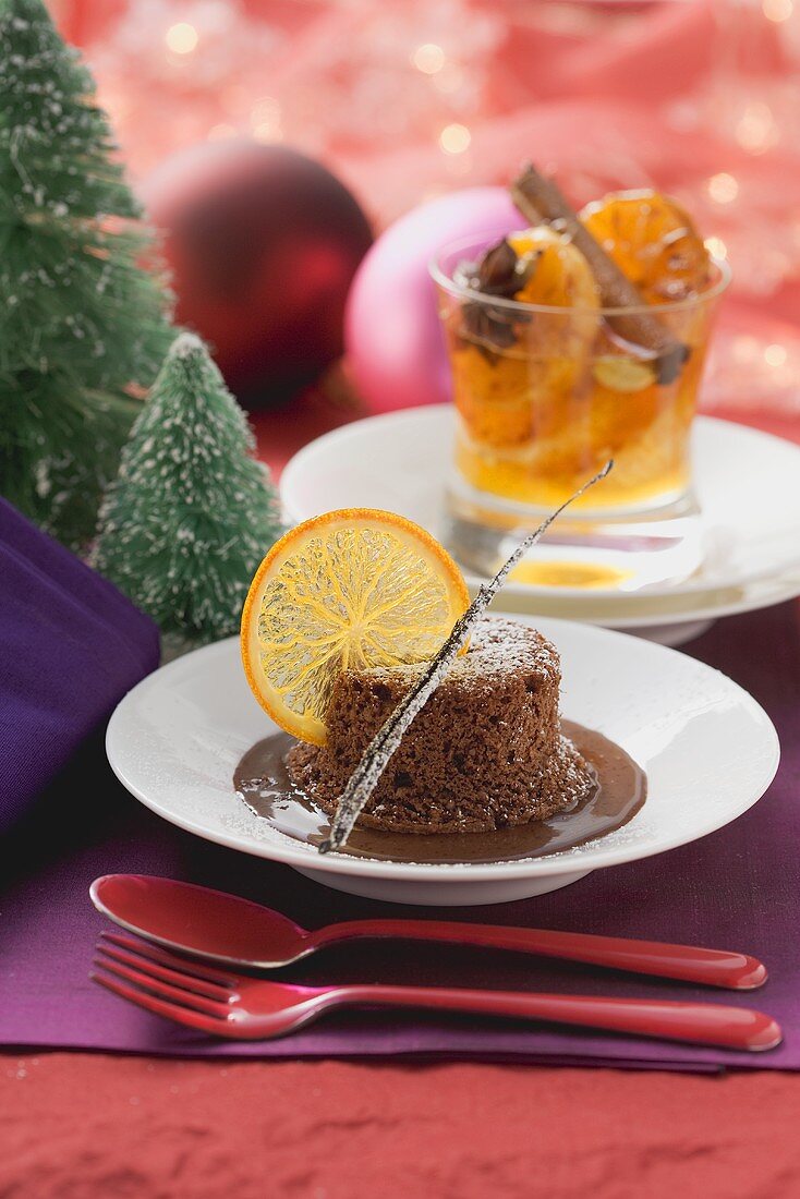 Warm chocolate pudding with orange slices