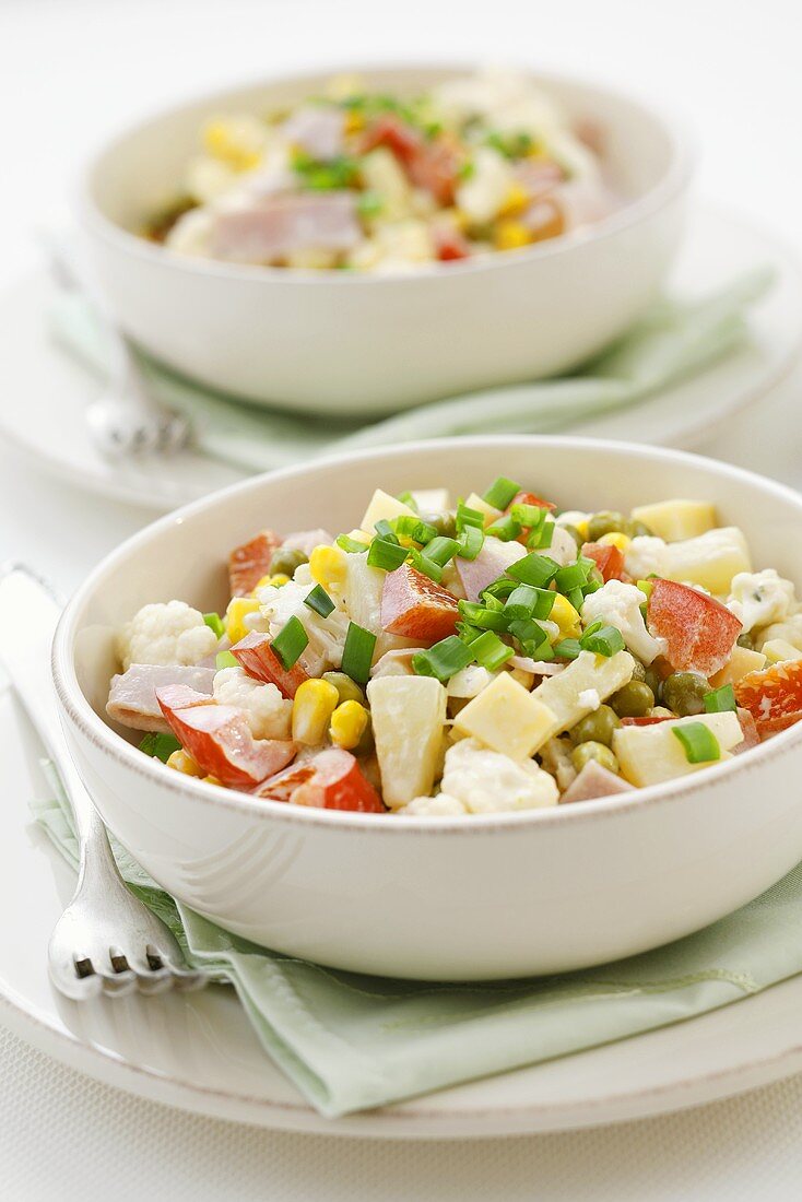 Mixed vegetable salad with ham, pineapple, cheese, mayonnaise