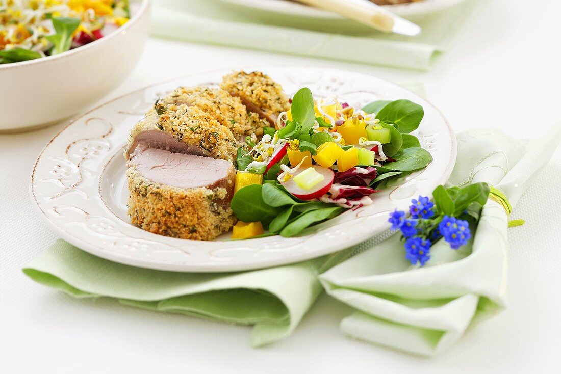 Pork fillet in herb crust with mixed salad